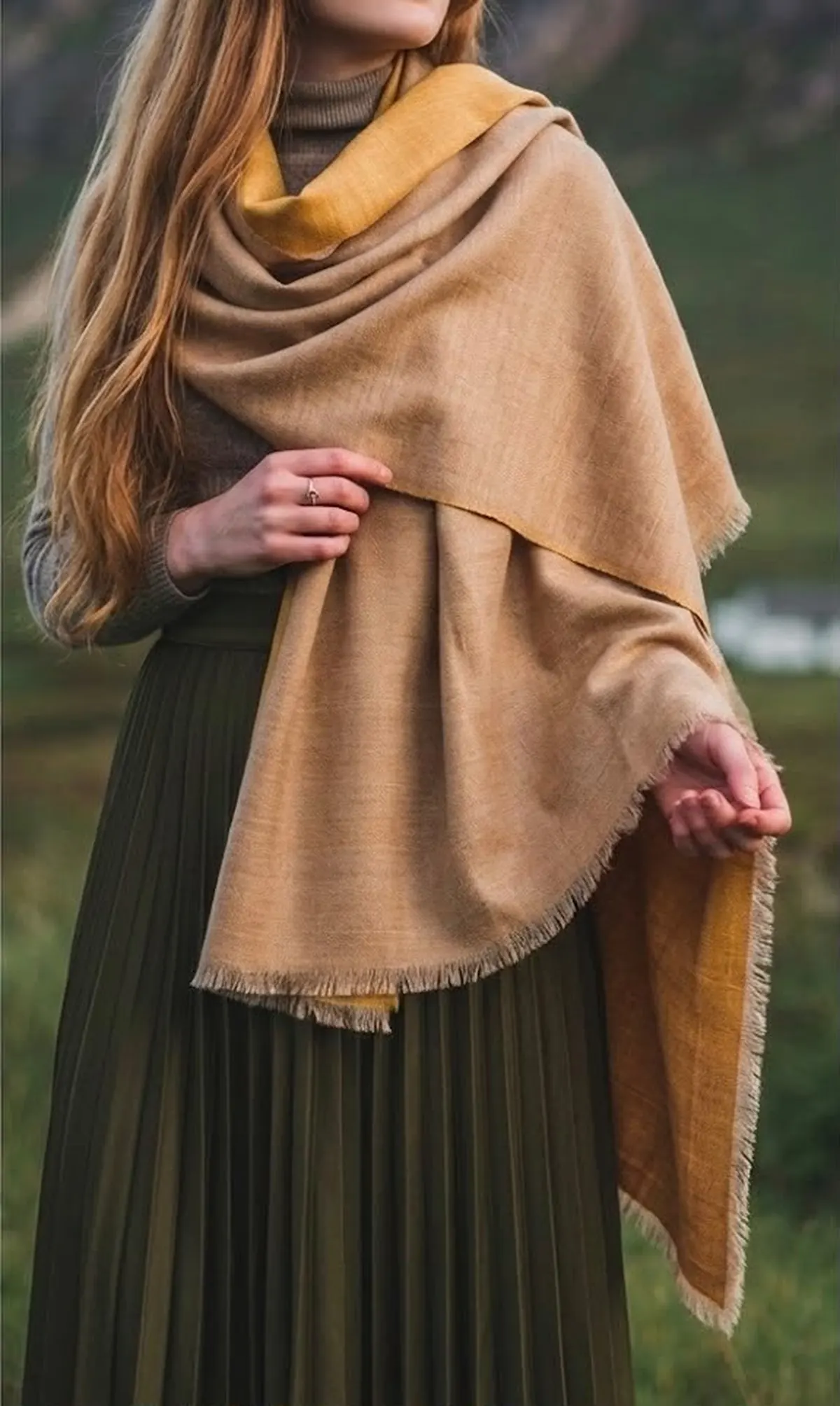 Woman in camel cashmere shawl